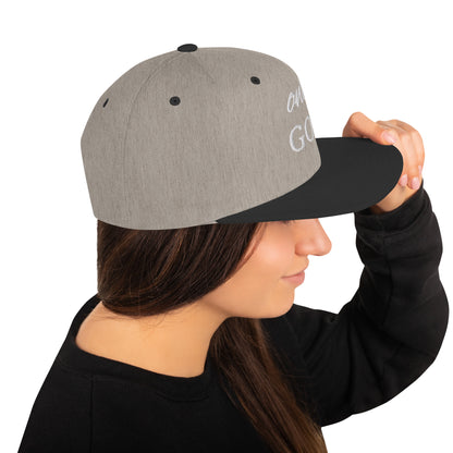 "Sleek snapback cap with a design inspired by mountain peaks."

